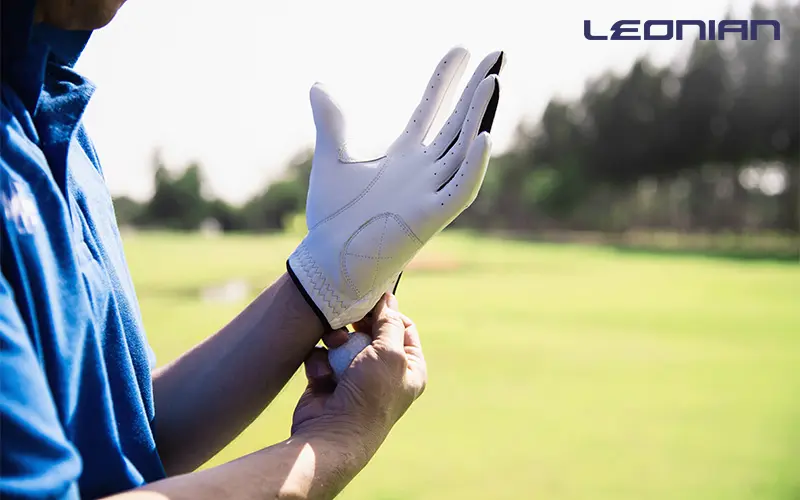 man wearing golf gloves.