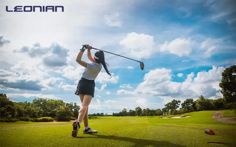 woman in golf apparel playing golf in singapore.